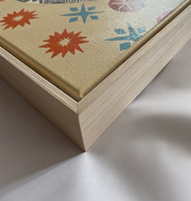 Grey plate on peach and orange wallpaper depicting a child watching a bonfire on fire cracker night