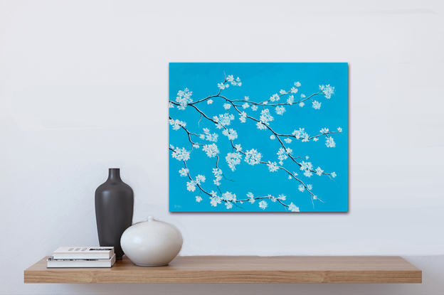 A textured painting of a branch of white blossom on a turquoise blue background.