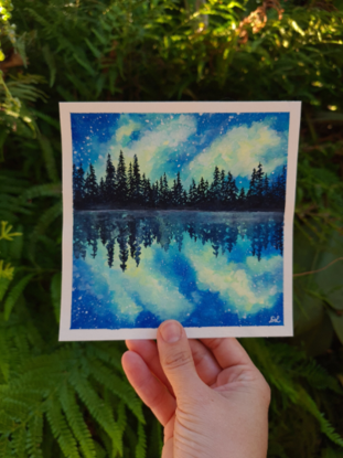 pine tree silhouette against a starry blue and yellow sky