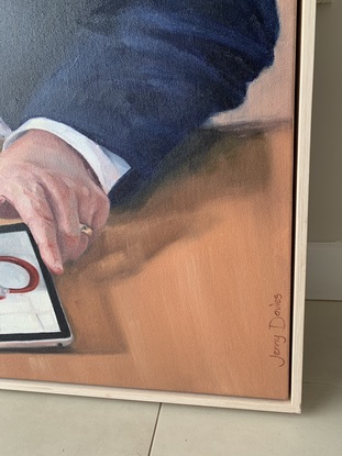 A painting of Western Australian Premier Mark McGowan sitting at his desk looking bemused as he looks at his social media pages on his iPad.