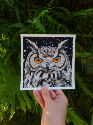 owl against a starry night background