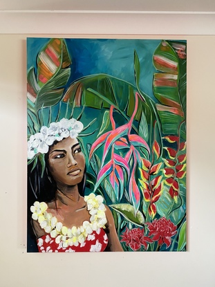 A beautiful island wahine embracing her lush tropical surroundings. Tropical flowers at her fingertips, the smell of fresh sea air and warmth of the rainforest kissing her damp skin.