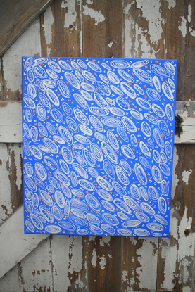 Deep blue background with spirals depicting shells and small dots around 