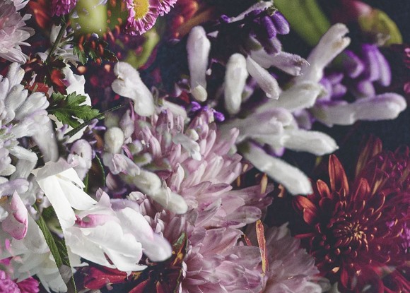 Floral bouquet with vintage glass vase.