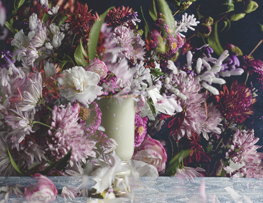 Floral bouquet with vintage glass vase.