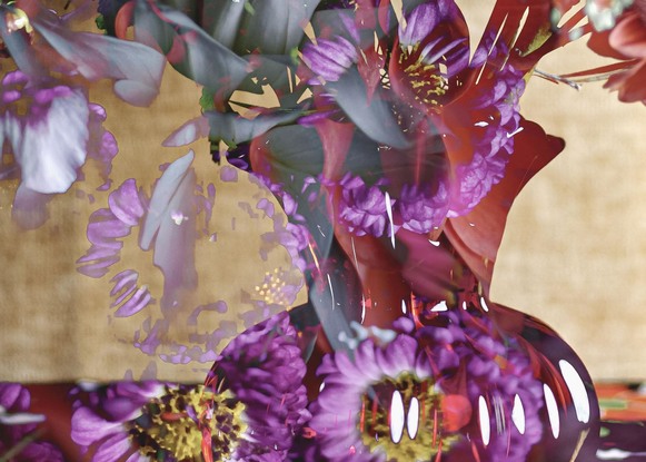 Floral bouquet with vintage glass vase.