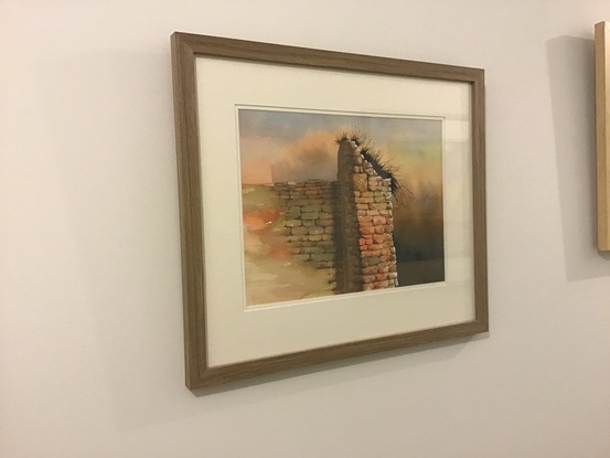 Stone wall, beige, dark gasses on top