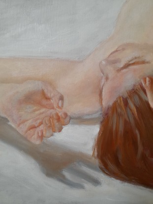 Foreshortened lying female nude on a hard floor.