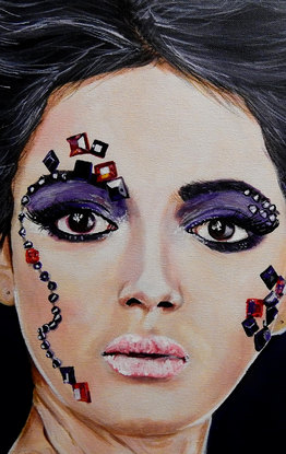 Portrait of delightful girl with jewels on her face.