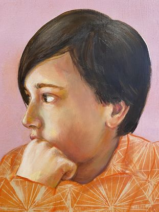 A portrait of a boy looking off side.