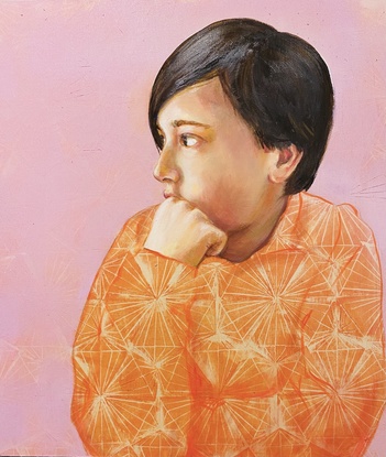 A portrait of a boy looking off side.