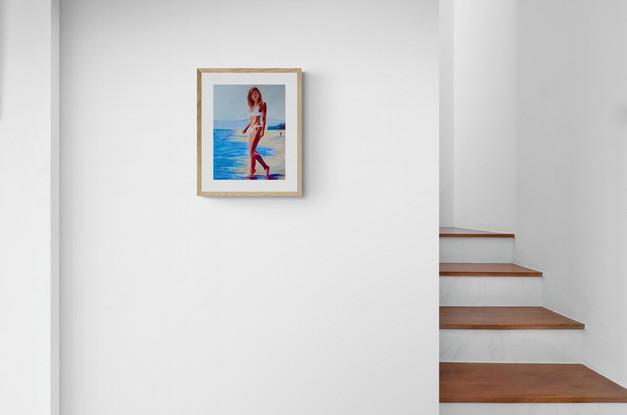 Woman standing at the edge of a pool in the sunshine.