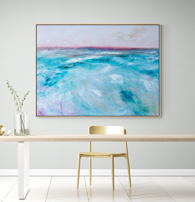 Abstract seascape in soft teal and magenta tones with mountain range in the horizon.