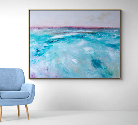 Abstract seascape in soft teal and magenta tones with mountain range in the horizon.