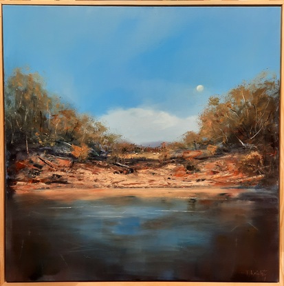 Outback riverbank waterhole with big sky