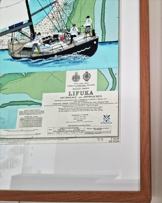 A yacht flying its spinnaker is painted onto an original chart (produced in 1993) of Lifuka in Tonga.  I have used the beautiful blues and aquas used in the chart.  A helmsman steers the boat and a grinder helps the spinnaker trimmer as they sail to their destination.