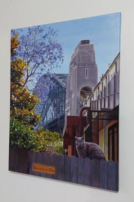 Landscape painting of the Sydney Harbour Bridge and a cat with a surprised look is on the fence in the foreground. A sign   with the words "Beware of the Dog" is below the cat adding a humorous twist.