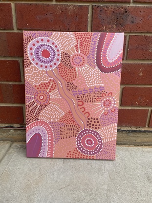 Pink, purple, and apricot coloured Aboriginal painting