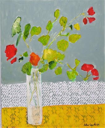 red flowers in white glass vase