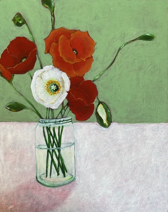 Still life of colourful poppies in glass vase