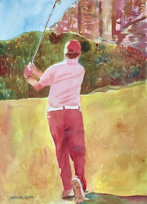 Golfer hitting a ball wearing red trousers.