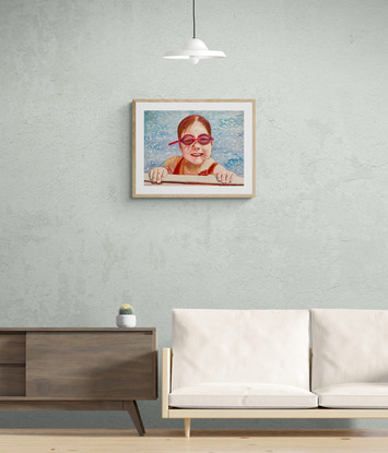 Girl smiles whilst resting at the edge of swimming pool.