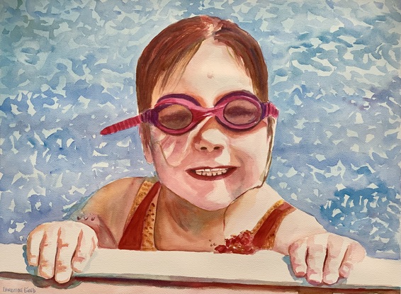 Girl smiles whilst resting at the edge of swimming pool.