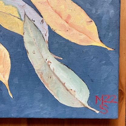 a number of decaying gum leaves scattered across the canvas on a dartk blue background