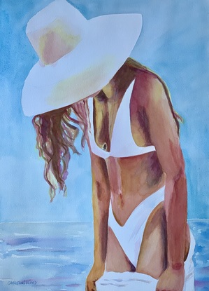 Woman in a bikini and a sun hat.