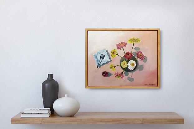 A birds-eye view of some Scenic Rim flowers in a round vase beside an antique blue plate and silver vintage sugar spoon.