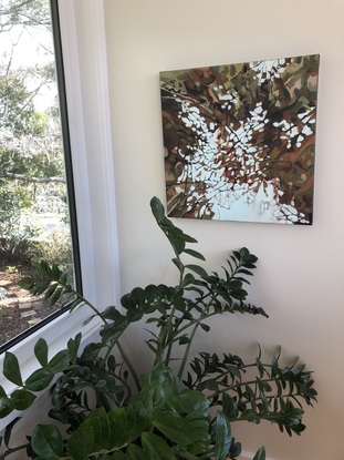 Abstract painting of dappled appearance. The reflection of the sky is pale blue and the reflections of the leaves are different shades of brown.