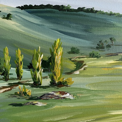 Rolling green hills and secret valleys scattered with trees and a winding dirt track depicted in this country landscape. 