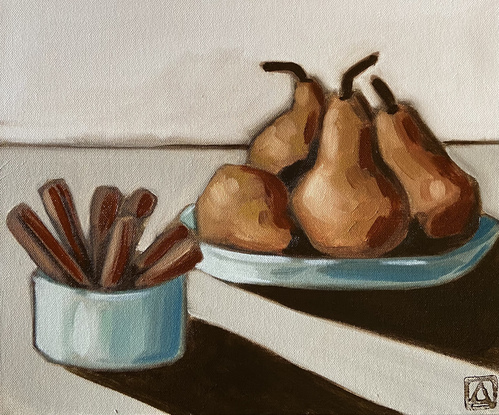 Pears in a bowl with cinnamon sticks on a minimal neutral background.