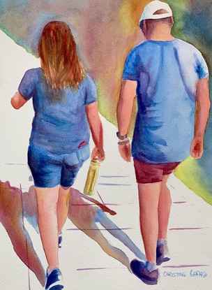 Couple walking in the sunshine.