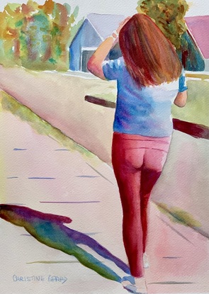 Woman walking in the sunshine.