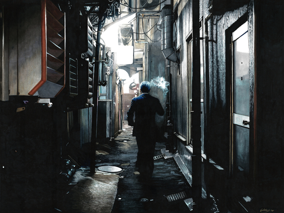 Dark alley in Tokyo with a man smoking