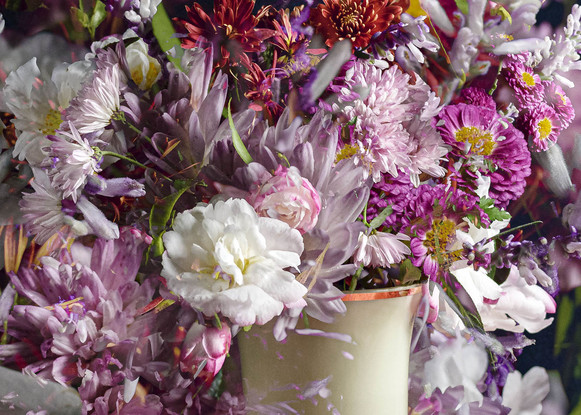 Floral bouquet with vintage glass vase.