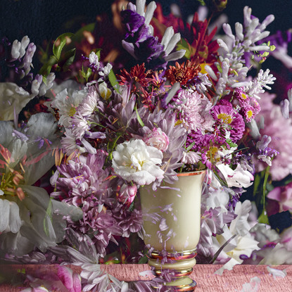 Floral bouquet with vintage glass vase.