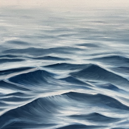 Ocean surface under a grey sky