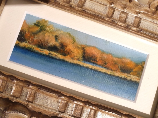 Small impressionist landscape river painting by Australian artist Victoria Collins, in soft autumn tones of ochre and blue. 