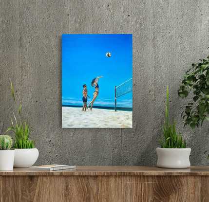 A couple of friends playing beach volleyball on the surfers paradise broad beach Gold Coast.