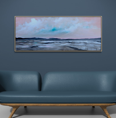 Colourful and fresh abstract seascape in teal and pink tones with mountain range in the horizon under cloudy sky.