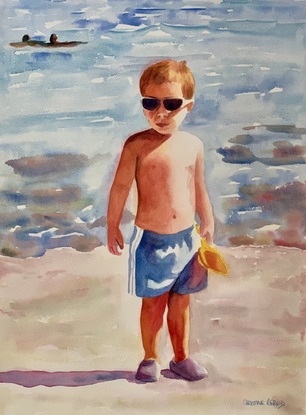 Boy stands in the sunshine.