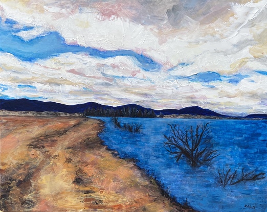 Lake Jindabyne shoreline with blackened edges, mountains in distance. A large cloud formation.Textured expressive paint.

