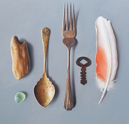 Old cutlery and vintage keys arranged in a raw with  sea glass , driftwood and Pink Cockatoo feather to emphasize the beauty of manmade and natural things.