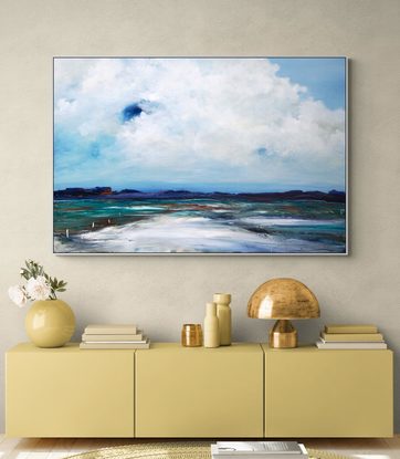 Abstract seascape in grey blue  and teal with mountain range in the horizon under a dramatic cloudy sky.