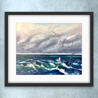 Seagulls gliding above the waves