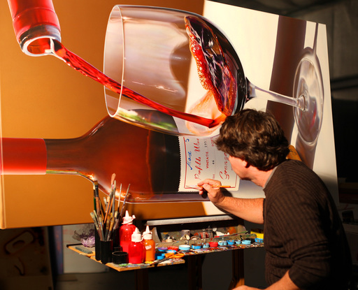 A painting of a large  wine bottle of Penfolds Grange . Created in hyper realism /andorealism style  in sharp focus enlarged a 500 times original size . One RIEDEL glass sits with the bottle that has a 1959 label of Penfolds  hidden grange with Max Schubert' signature.  Another bottle is pouring wine in to the glass. A Penfolds cork sits on the table and is reflected in the bottle on the table.  The table surface is white and the background is a warm chocolate brown.