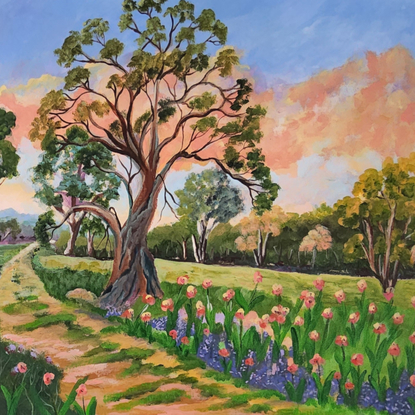 
Riverina Bushwalk is a delightful natural serene landscape painting, featuring a path leading into the distance, with colourful flowers in both cool and warm shades, Australian gum trees scattered around the landscape under a lively warm coral and blue sky.