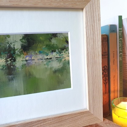 Small landscape oil painting of a silvery calm river with reflections of forest.